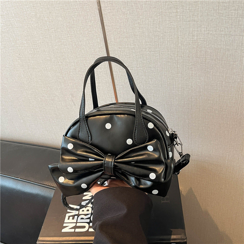 Schleifenverzierte Handtasche