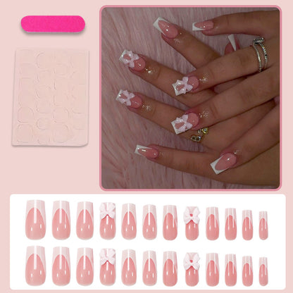 Kunstnagel-Set mit glamourösen Schleifen- und Glitzerakzenten Brehn