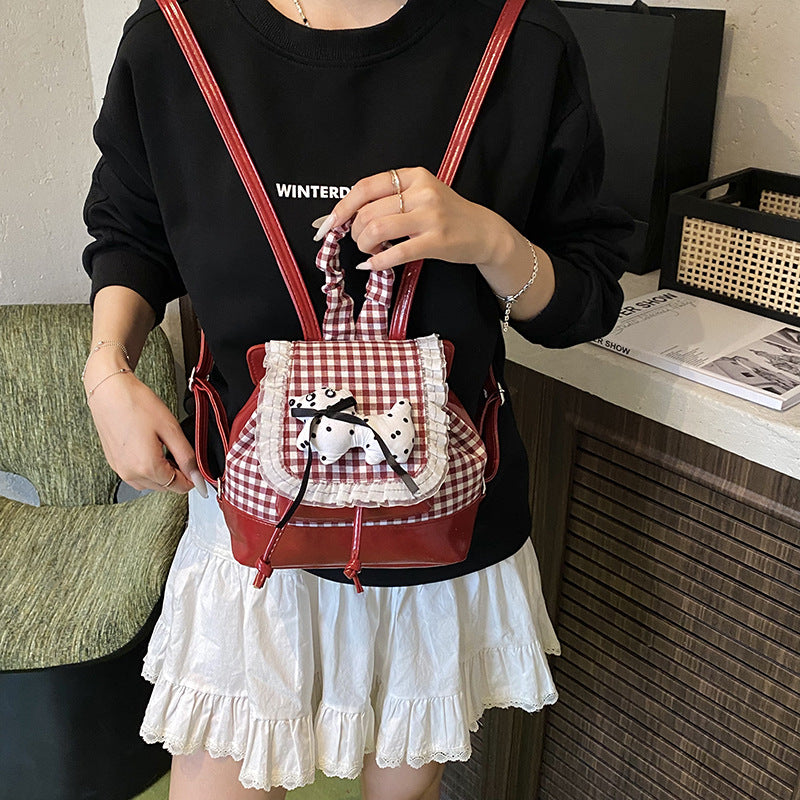 Verspielter Rucksack mit Karomuster und Tierapplikation Brehn