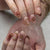 Kunstnagelset mit floralen und eleganten Goldverzierungen Brehn