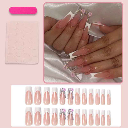 Kunstnagelset mit eleganten Glitzer- und Blütenakzenten Brehn