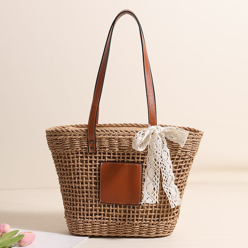 Damen Korbtasche mit eleganten Lederdetails und verspieltem Schleifenakzent Brehn