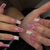 Kunstnagelset mit eleganten Blütenmotiven Brehn