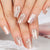 Kunstnägel mit floralem und glitzerndem Design Brehn