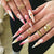 Dekorativer Stiletto Press-On Nagelkunst Set mit floralem Akzent Brehn