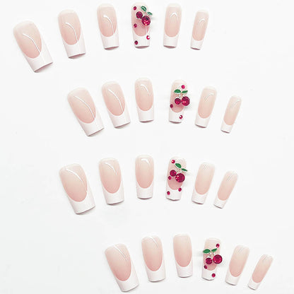 Kunstnagelset mit chicen Kirschmotiven und eleganter French-Spitze Brehn