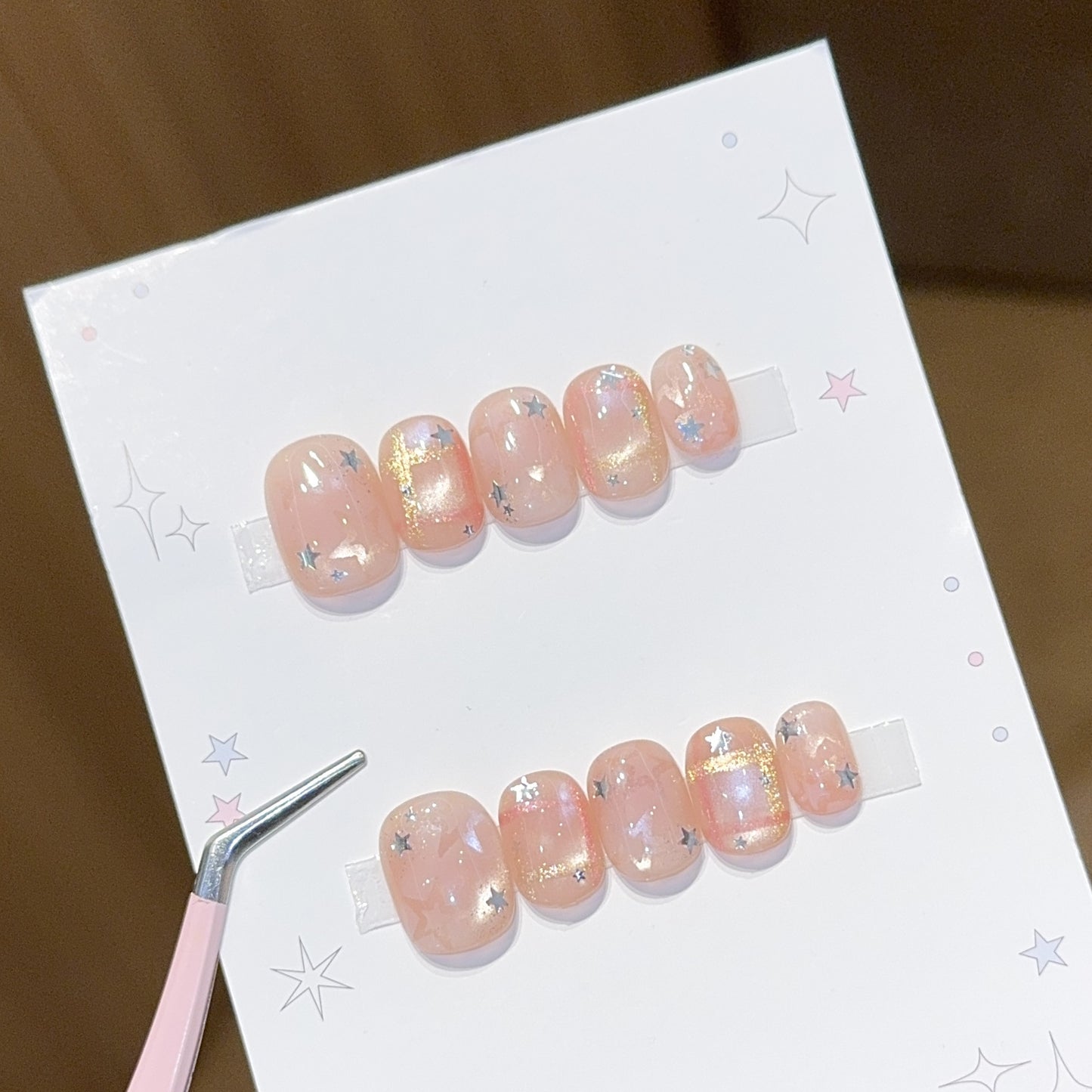 Glamouröse Kunstnagelspitzen mit Sternen Design Brehn