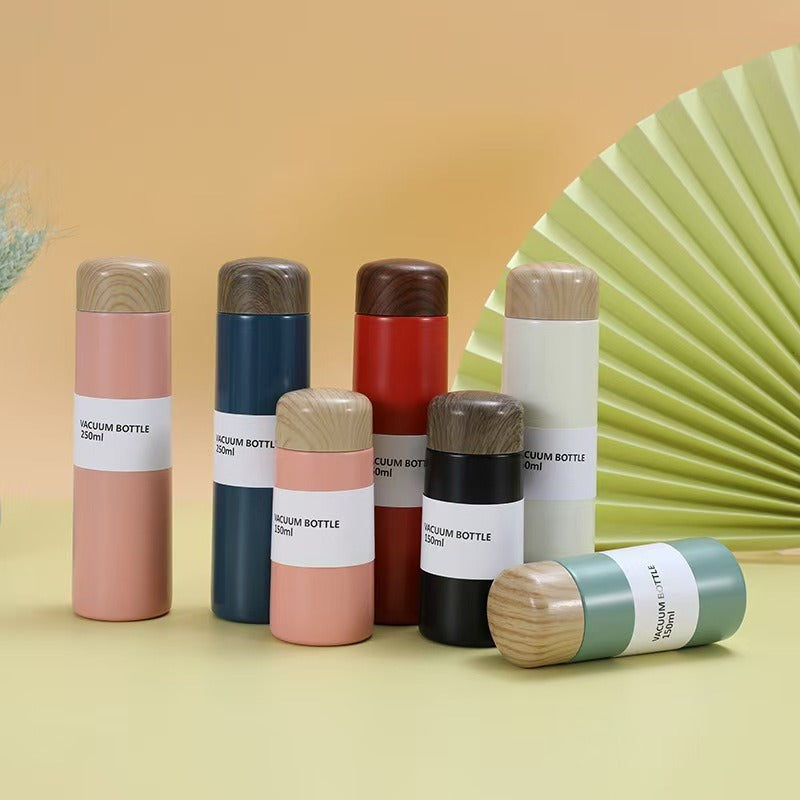 Damen vakuumisolierte Wasserflasche mit innovativem Holzdeckel Brehn