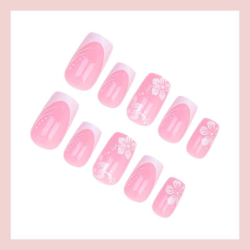 Kunstnagelset mit elegantem französischen Design und zarten Blütenmustern Brehn