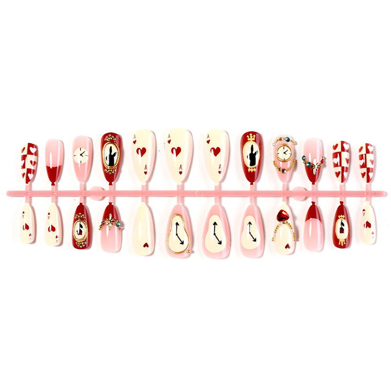 Künstlerisches Press-On-Nagelset mit kreativen Herz- und Uhrendesigns Brehn