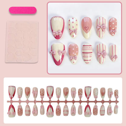 Kunstnagelset mit romantischen Schleifen- und Herzenmotiven Brehn
