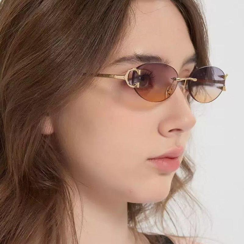 Damen elegante ovalförmige Sonnenbrille mit modischem Metallrahmen Brehn
