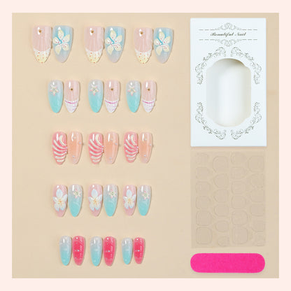 Kunstnägel Set mit floralen Designs und glitzernden Akzenten Brehn