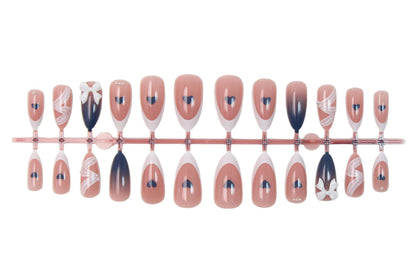 Kunstnagelset mit eleganten Schleifen und herzförmigen Akzenten Brehn