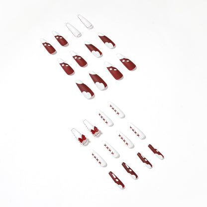 Kunstvolle Stiletto-Nägel mit Schleifen- und Zickzackdesign Brehn