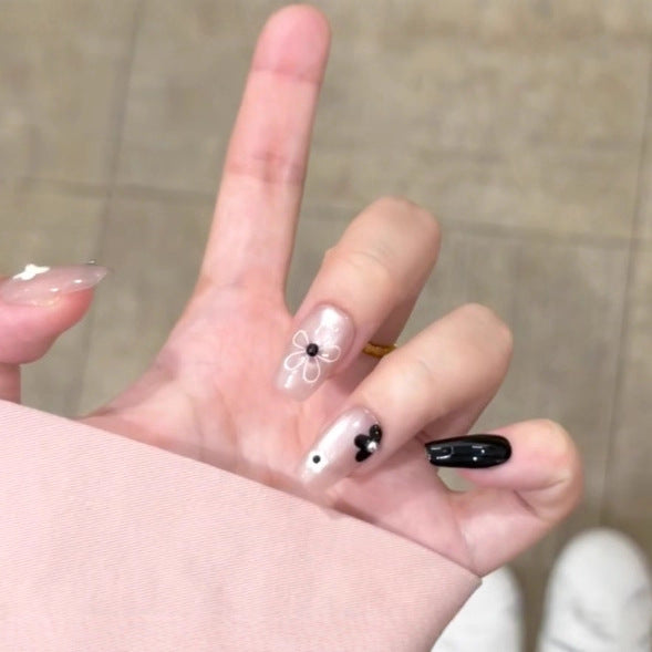 Künstlerisches Press-On Nagelset mit floralem und gesprenkelt Design Brehn