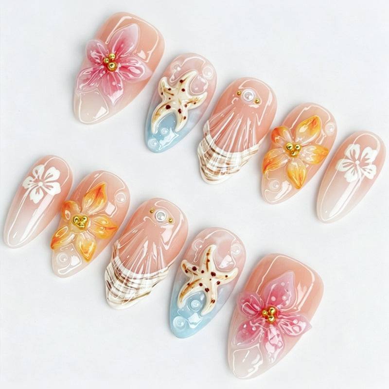 Kunstnagelset mit floralen Motiven und strahlenden Akzenten Brehn