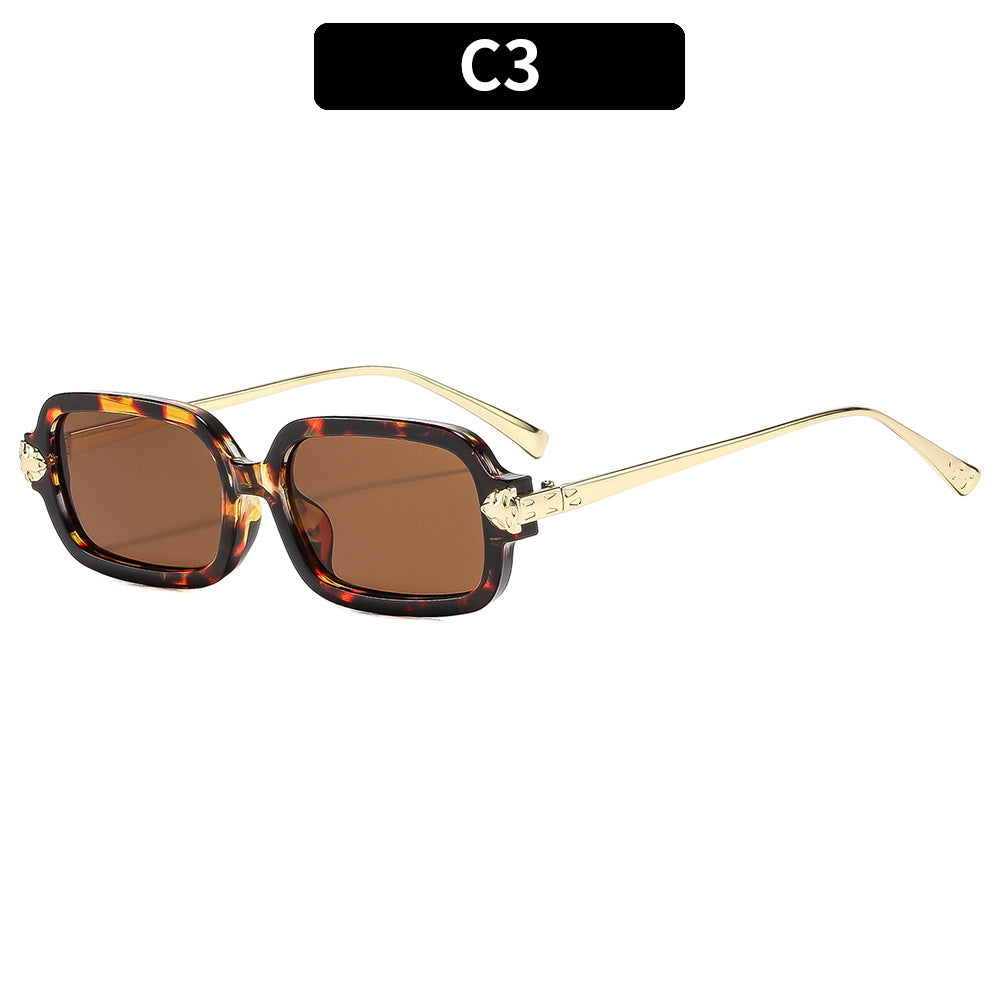 Hochwertige winkelige Sonnenbrille mit goldenen Akzenten