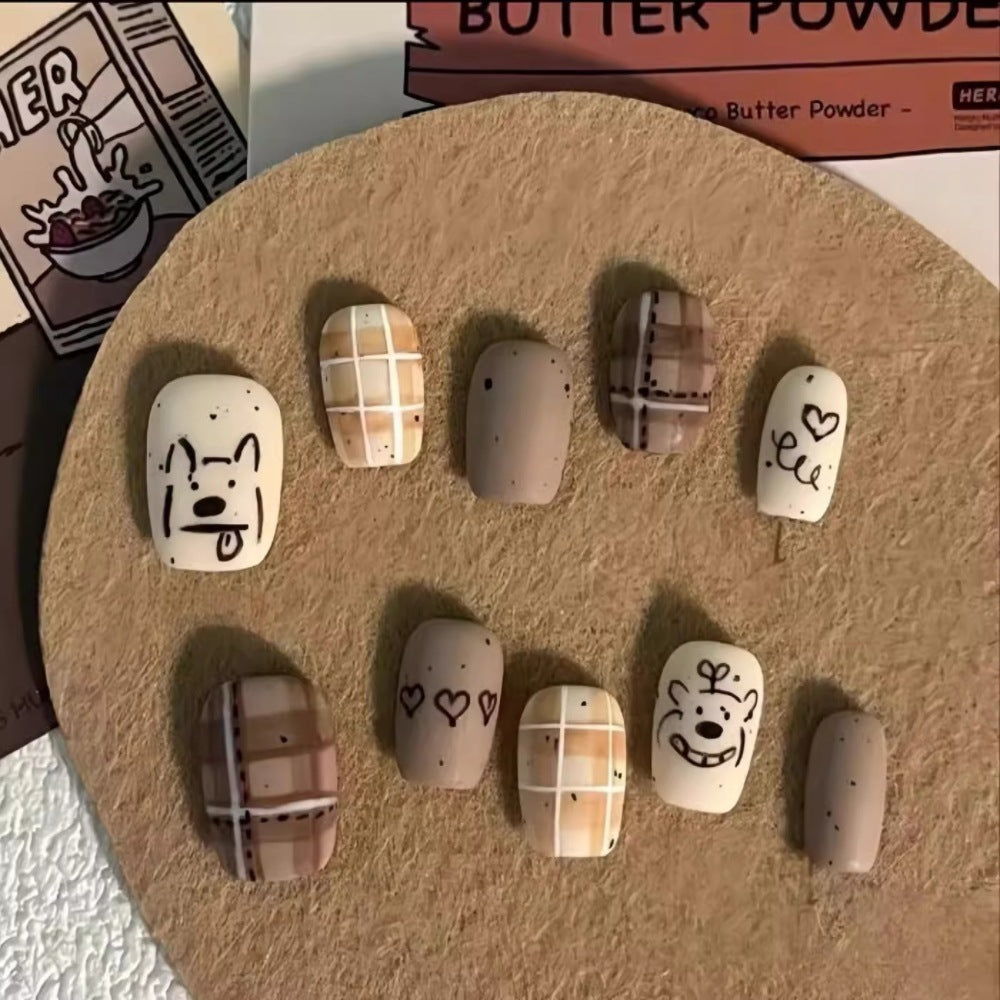 Künstlerisches Press-On-Nagelset mit einzigartigen Charakterdesigns Brehn