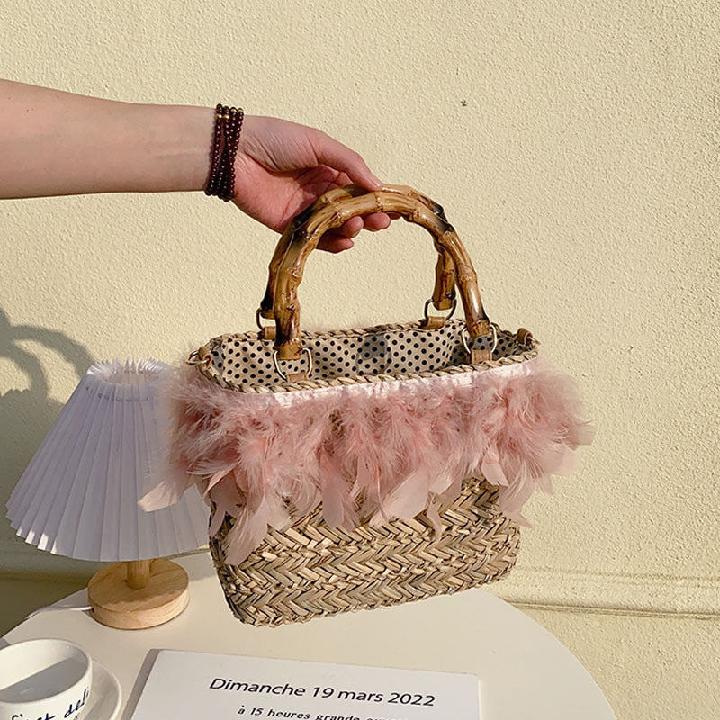Elegante Handtasche mit Federn und Bambusgriffen Brehn
