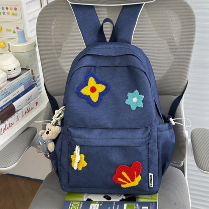 Blumenbestickter Schulrucksack