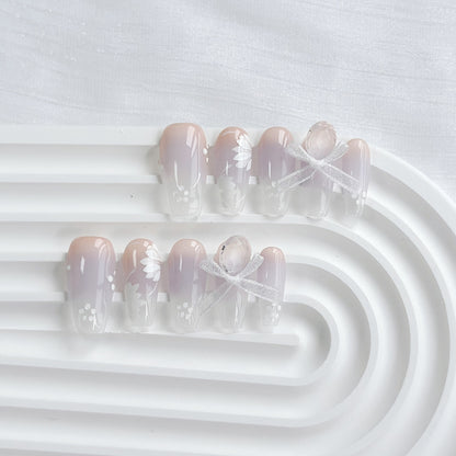 Künstlerisches Press-On Nagelkunstset mit Herz- und himmlischen Designs