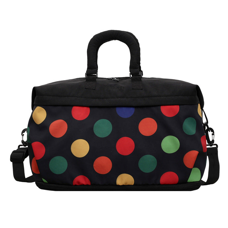 Bunte gepunktete Reisetasche