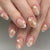 Kreatives Kunstnagelset mit zarter Blumendekoration und Glitzerelementen Brehn