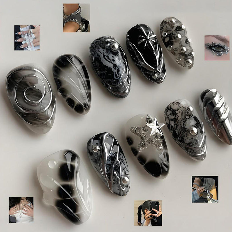 Kunstnagelset mit künstlerischen Mustern und Glitzerakzenten Brehn