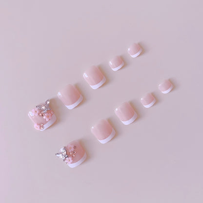 Kunstnagelset mit eleganten 3D-Blüten und Glitzerakzenten Brehn