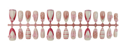 Kunstnagelset mit romantischen Schleifen- und Herzenmotiven Brehn