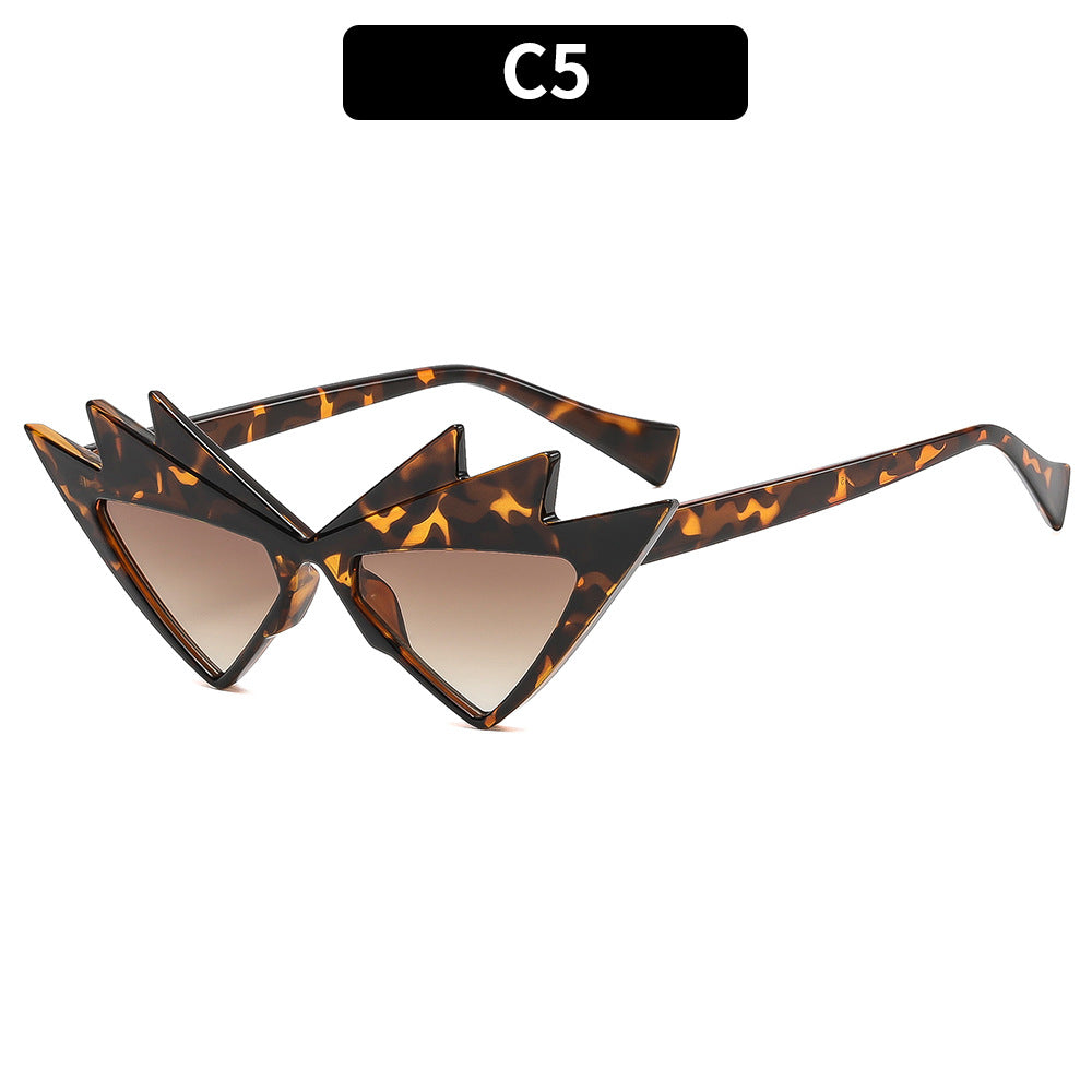 Kühne Katzenaugen-Sonnenbrille mit einzigartigem grafischem Rahmen