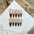 Glamouröses Stiletto Press-On Nail Art Set mit goldenen Akzenten Brehn