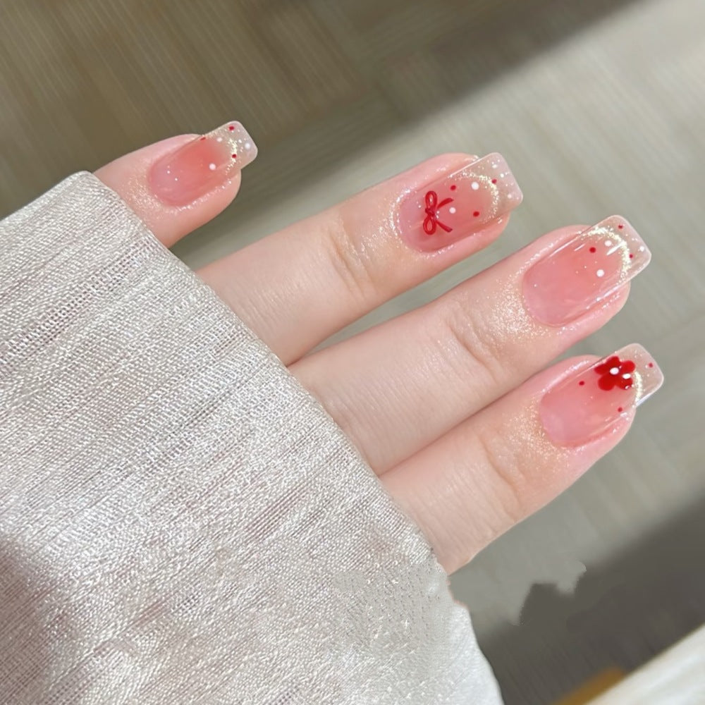 Dekoratives Press-On Nagelset mit floralen und Schleifenakzenten Brehn