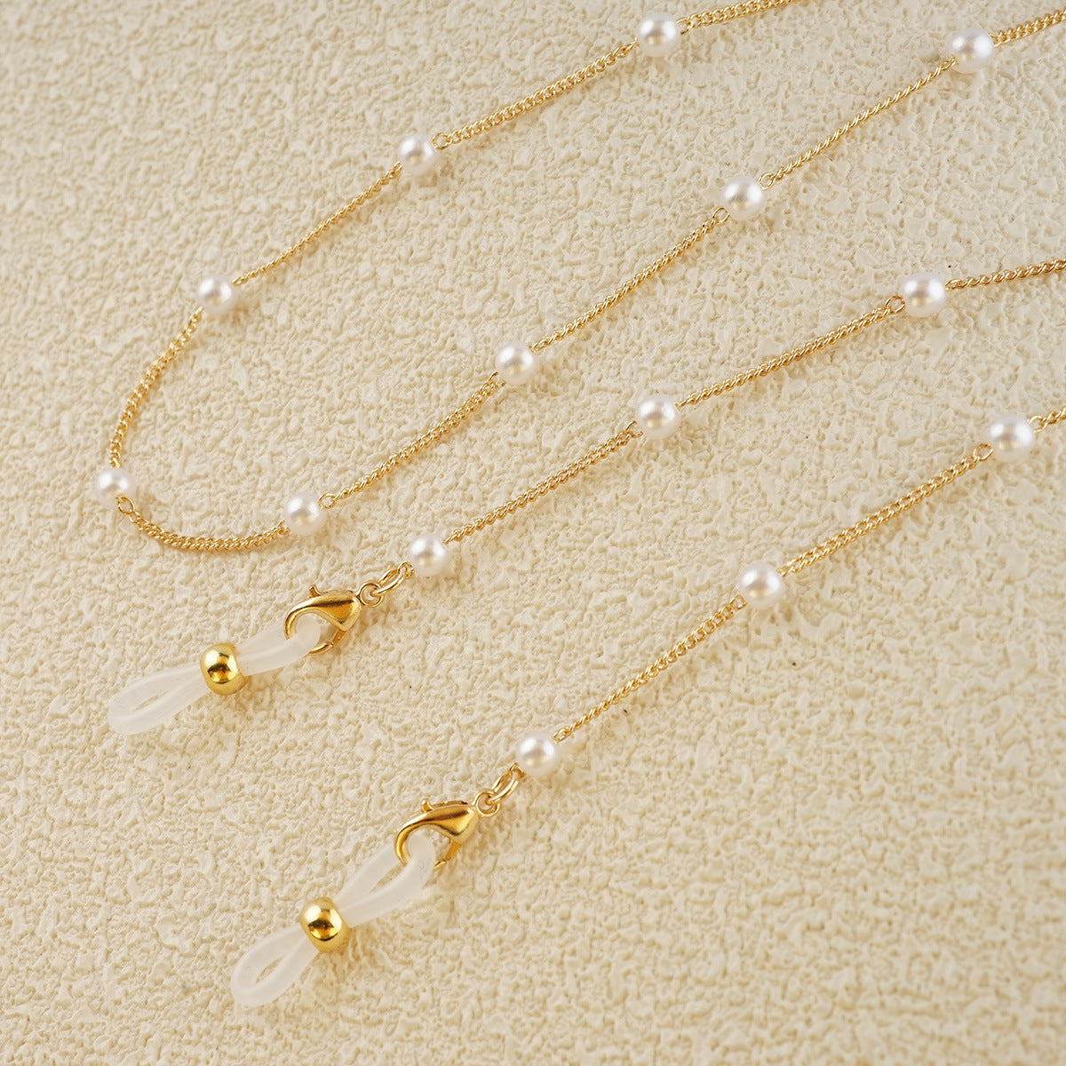 Eleganter mit Perlen verzierter Brillenhalter Brehn