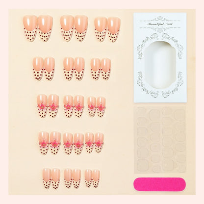 Kunstnagelset mit floralem Design und eleganten Punkten Brehn