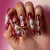 Kunstvolle Nagelkunst mit Glitzer- und Herzmotiven Brehn