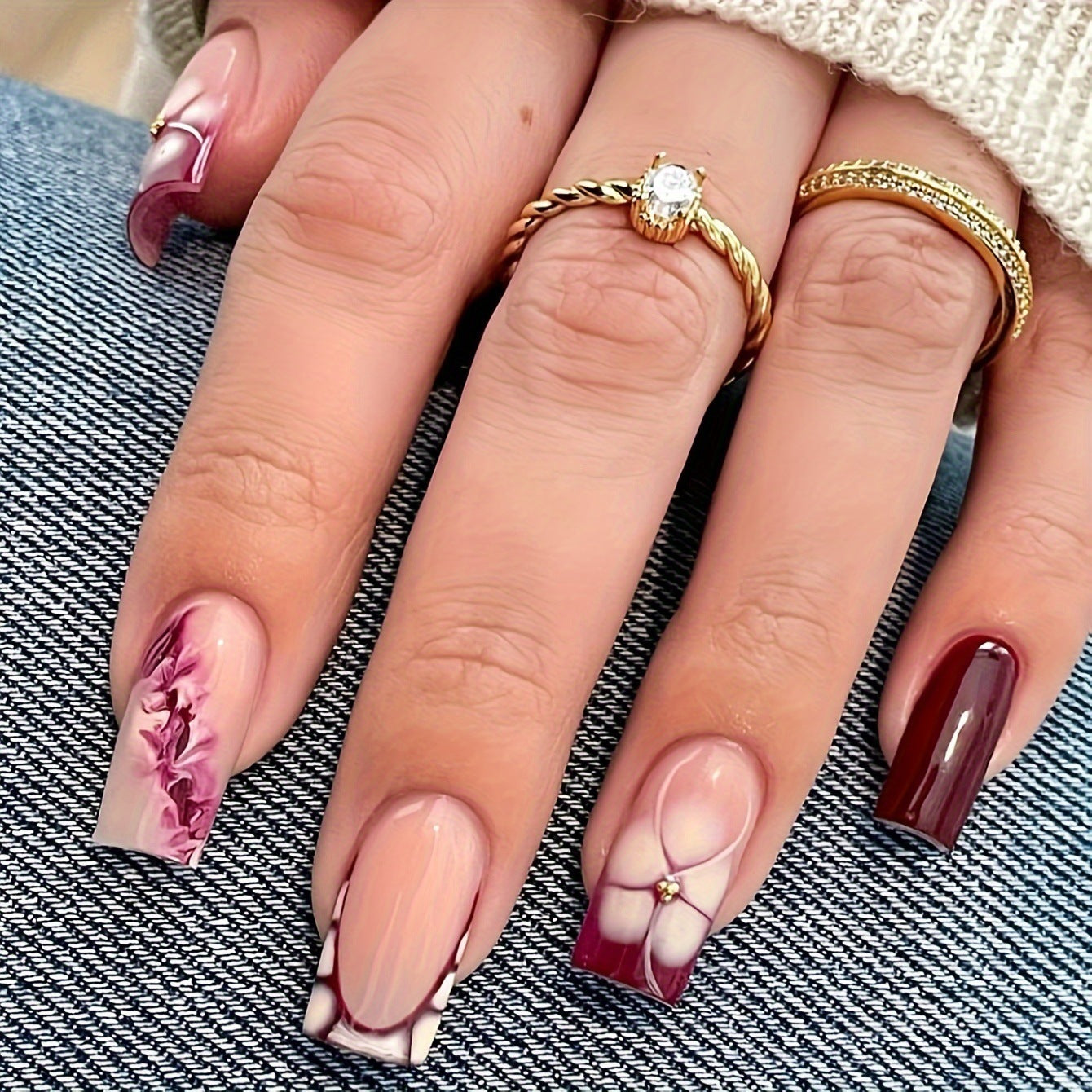 Künstlerische Gel-Nagelverlängerungen mit floralem Design Brehn