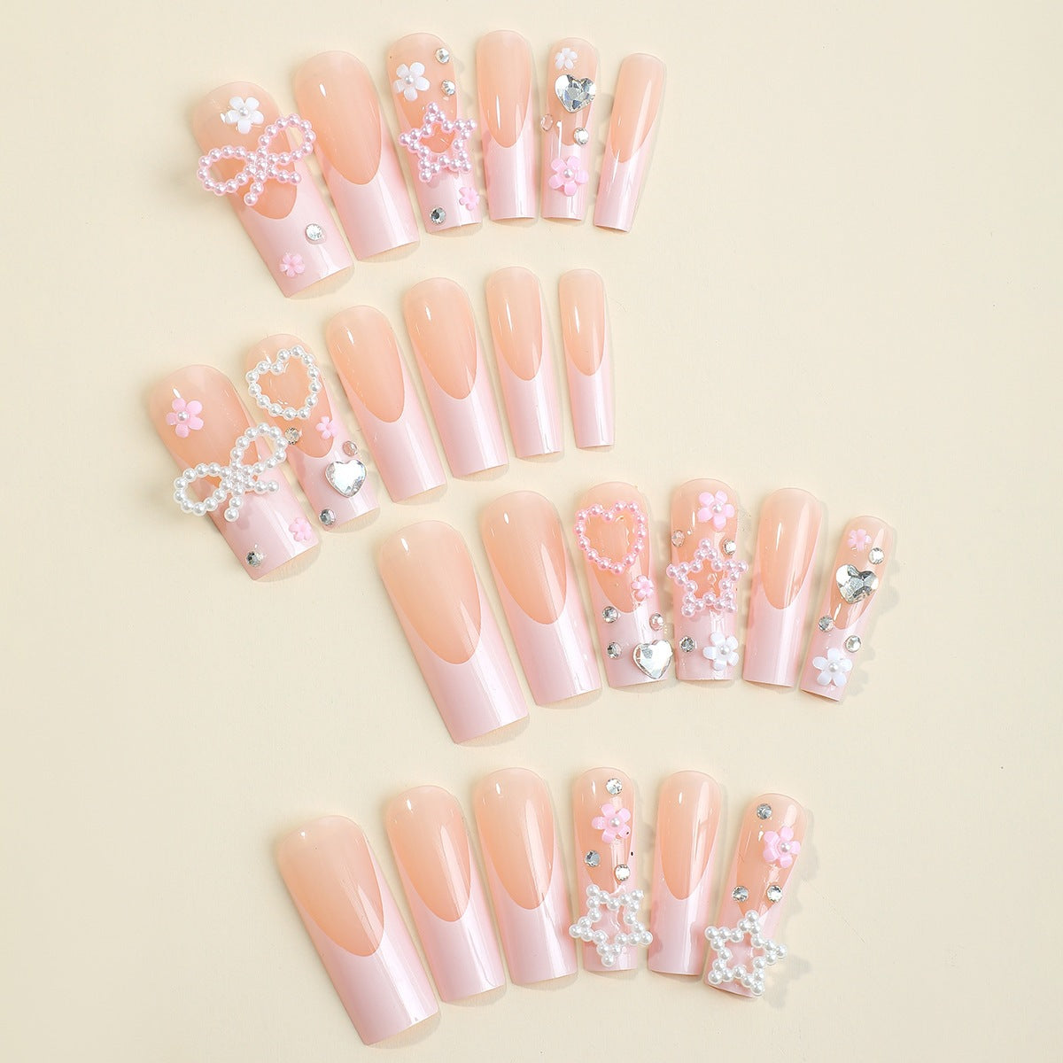 Glamouröses Kunstnagelset mit 3D-Schleifen und Glitzersteinen Brehn