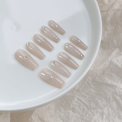 Dekoratives Stiletto Press-On Nagelset mit Kristallakzenten