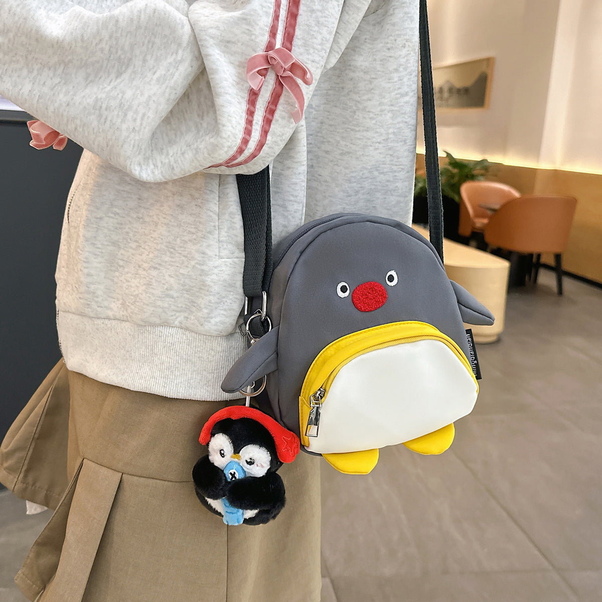 Verspielte Pinguin-Themen Umhängetasche