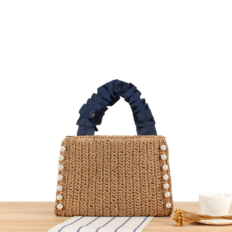 Elegante Handtasche mit Perlenverzierung und Rüschengriff Brehn
