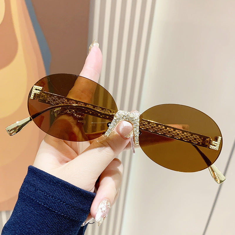 Damen Sonnenbrille mit glitzerndem Rahmen und ovalen Gläsern Brehn