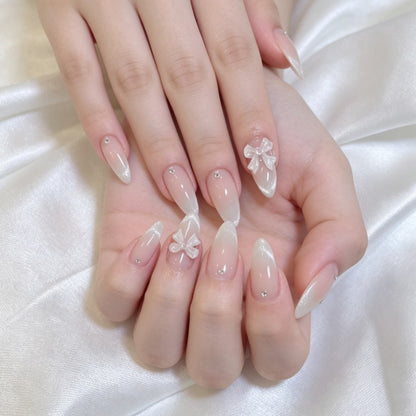 Elegantes Press-On-Nagelset mit dekorativem Bogen und Strassakzenten Brehn