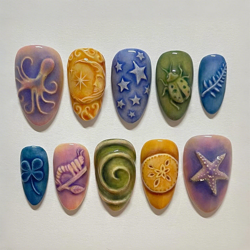 Kunstnagelset mit kreativen maritimen und naturinspirierten Motiven Brehn