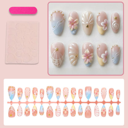 Kunstnagelset mit elegantem Blüten- und Muscheldesign Brehn