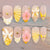 Künstlerisches Press-on-Nagelset mit floralen und dekorativen Designs Brehn
