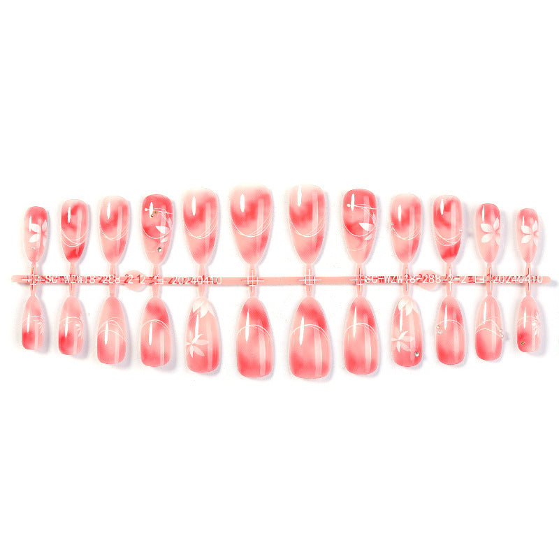 Kunstnagelset mit elegantem Ombre-Design und floralem Akzent Brehn