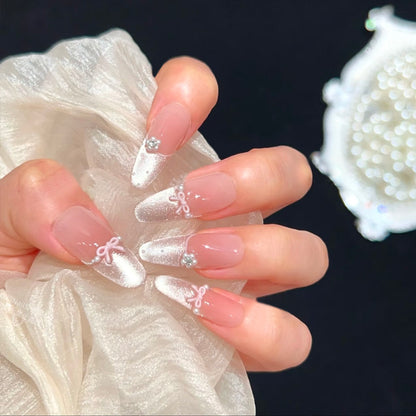 Kunstnagelset mit eleganten Schleifen- und Strassverzierungen Brehn
