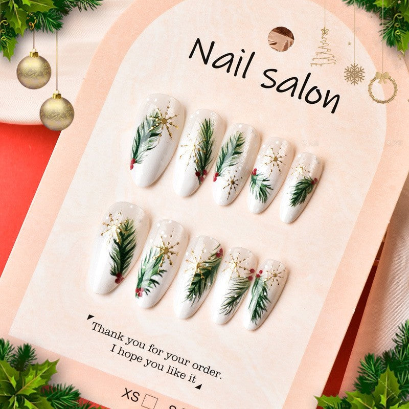 Kunstnagelset mit eleganten Weihnachtsmotiven und goldenen Akzenten Brehn